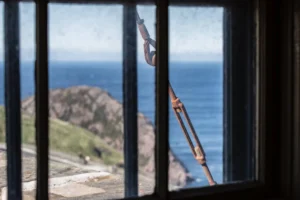 salt buildup on coastal home window glass near the ocean