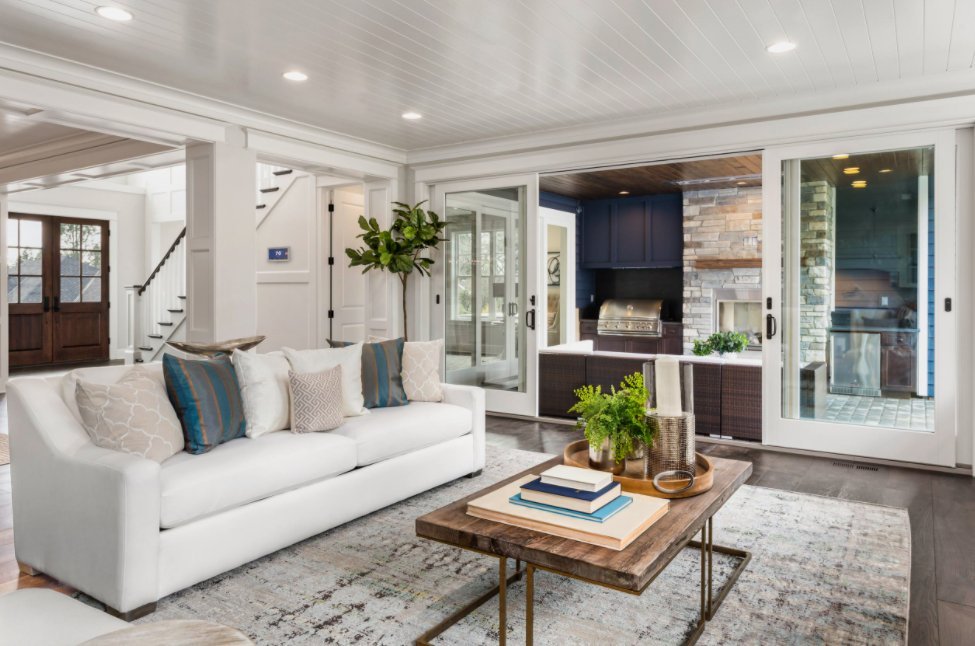professional cleaner caring for high-end finishes in coastal home